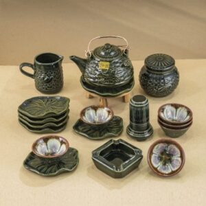 High-end Bat Trang artisan tea set with lotus and fish design.
